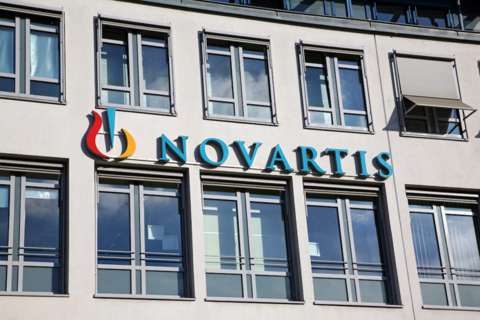 house facade with Novartis neon sign