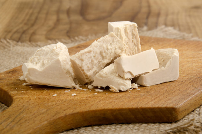yeast cube on a wooden board