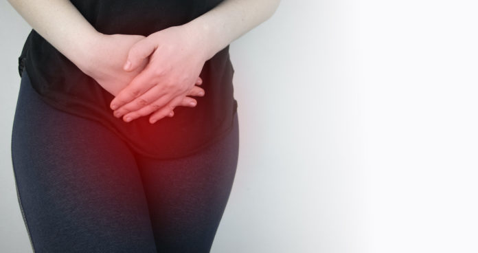 A woman suffers from pain in the pelvic organs. The gynecologist examines the patient. Painful location, female disease, cystitis, or urinary incontinence ESMYA