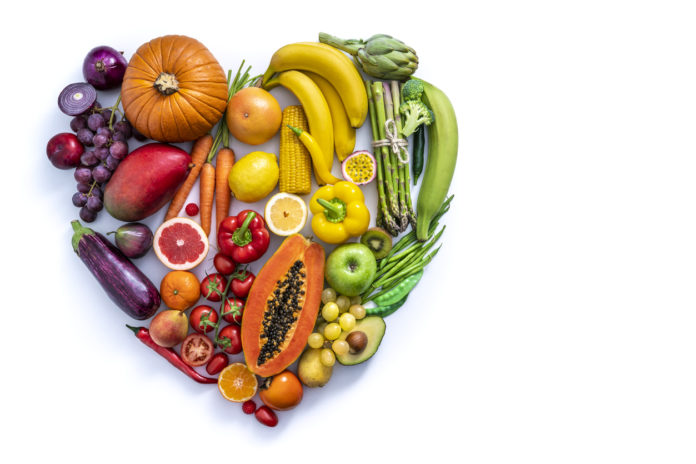 Vegetables and fruit with heart shape as concept of cardiovascular health on white CUORE