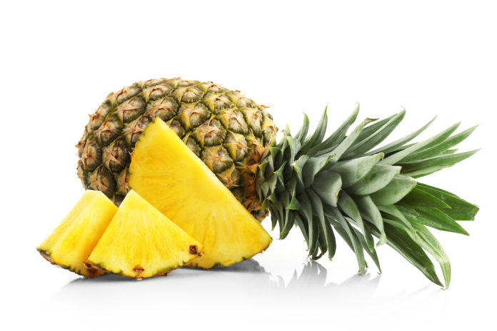 Sliced pineapple, isolated on white ANANAS