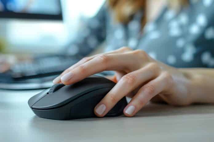 agcom Closeup of a womans hand using a mouse, with a desktop computer and ample copy space, more clarity with clear light and sharp focus, high detailed agcom