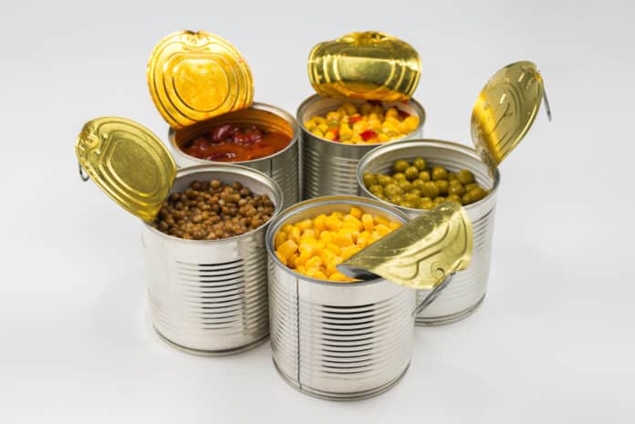 Canned food on white background. Green pea, beans, corn, lentils. BISFENOLO