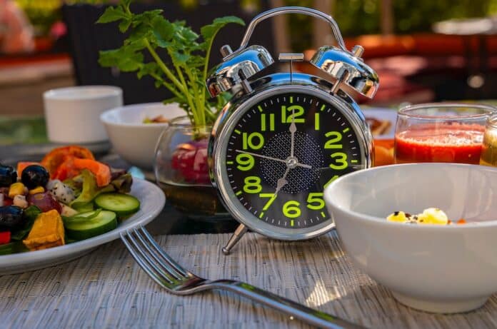 Alarm clock with IF (Intermittent Fasting) 16 and 8 diet rule and weight loss concept.-Diet plan concept dieta