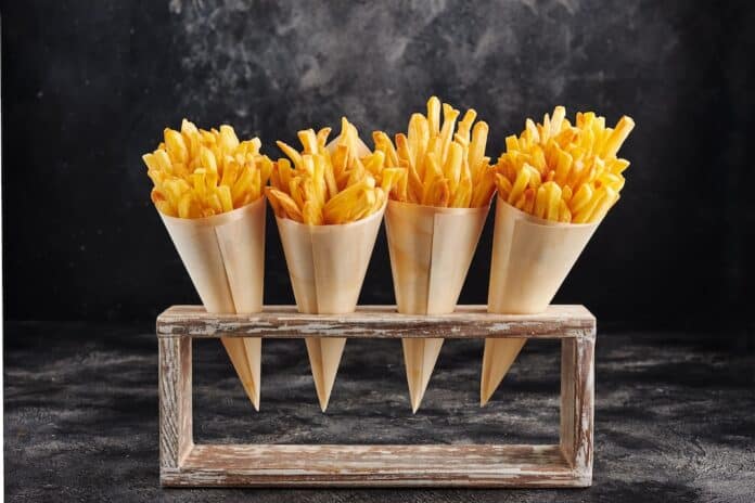 French fries in white paper with holder CARTA PER FRITTURA