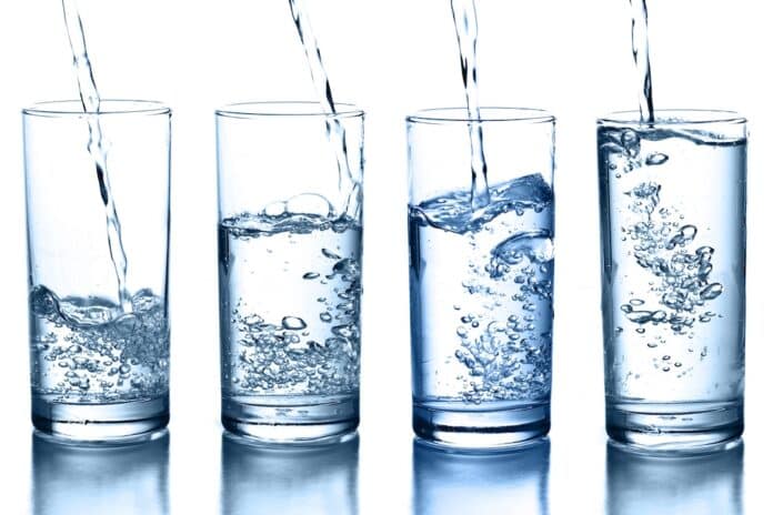 pouring water in a glass collection isolated ACQUA MIENRALE PFAS TFA