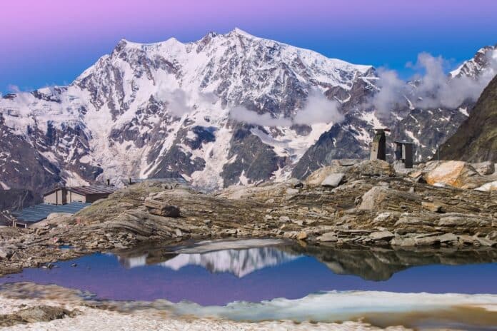 Amazing and romantic view of alpine lake with Monte Rosa in the background at dusk, Piedmont Italy pfas