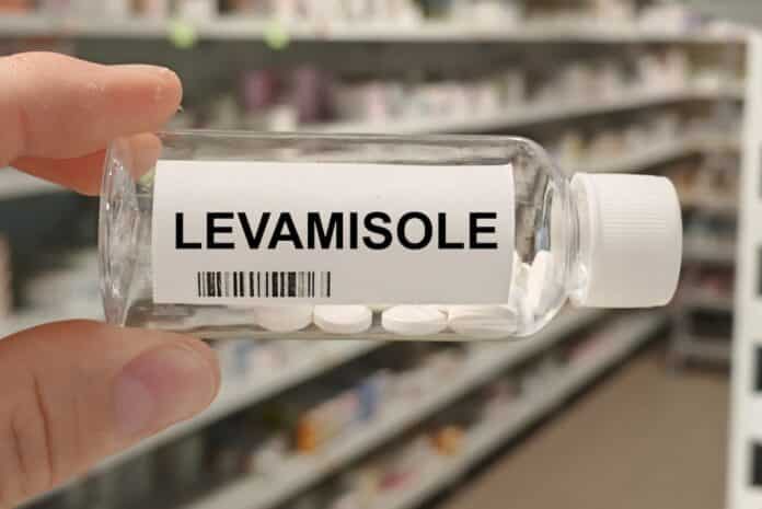 Box of LEVAMISOLE tablets on a hospital pharmacy table used to treat parasitic worm infections an anthelmintic and immunomodulator. LEVAMISOLO