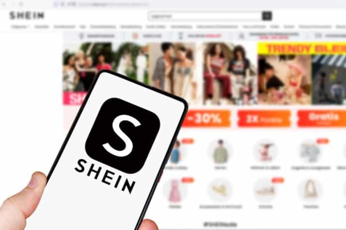 Shein logo online marketplace ecommerce on a mobile phone and computer shein